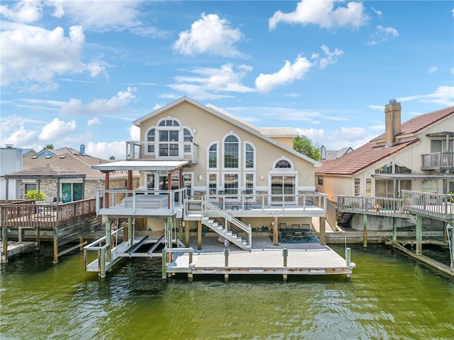 dock area with a deck with water view