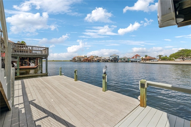 dock area with a water view