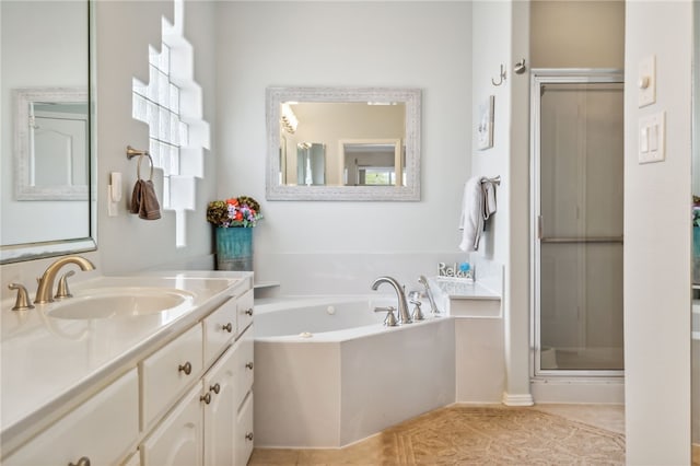 bathroom featuring tile patterned flooring, vanity, and independent shower and bath