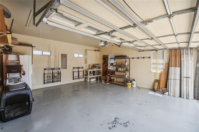 garage featuring electric panel and a garage door opener