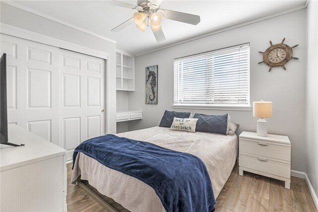 13965 Ports O Call Dr Unit D, Corpus Christi, TX 78418 - bedroom with light wood finished floors, a closet, a ceiling fan, and crown molding