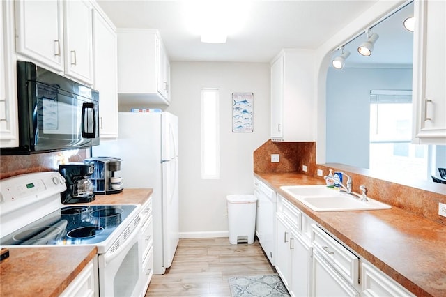 13965 Ports O Call Dr Unit D, Corpus Christi, TX 78418 - kitchen featuring white range with electric stovetop, black microwave, and white cabinets
