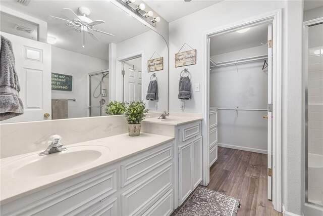 13965 Ports O Call Dr Unit D, Corpus Christi, TX 78418 - full bath with a shower stall, double vanity, wood finished floors, and a ceiling fan