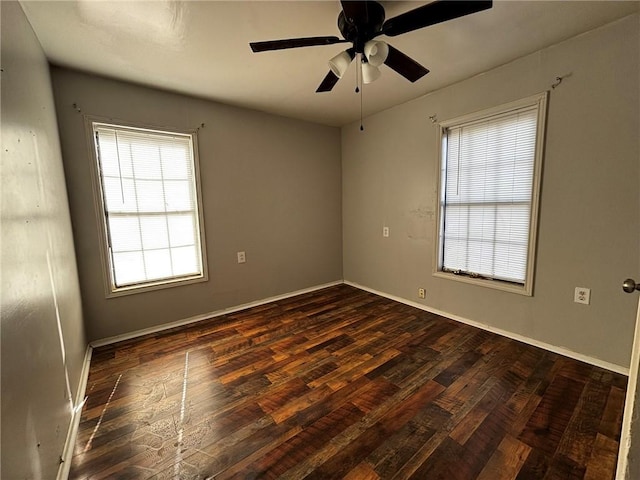 unfurnished room featuring ceiling fan and dark hardwood / wood-style flooring