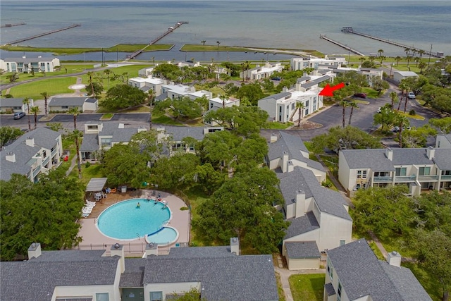 bird's eye view with a residential view and a water view