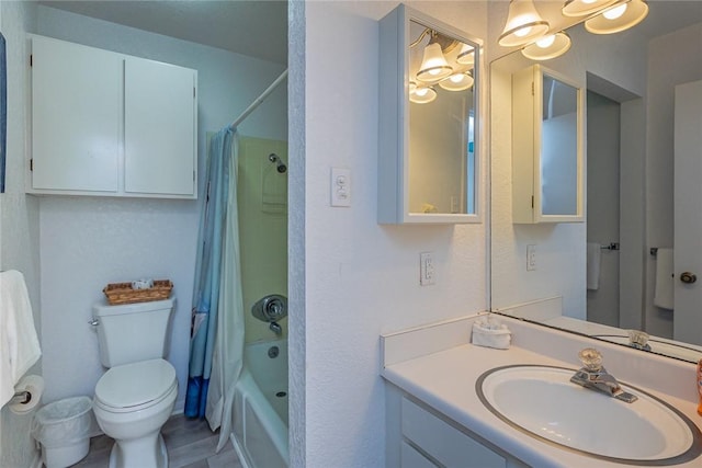 full bathroom with shower / bath combination with curtain, vanity, and toilet