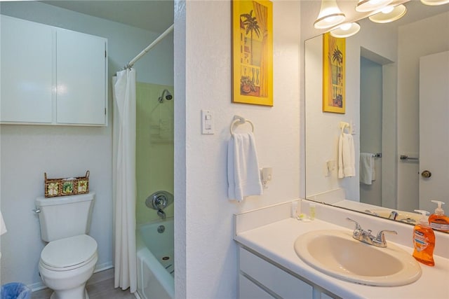 bathroom with shower / bathtub combination with curtain, toilet, and vanity