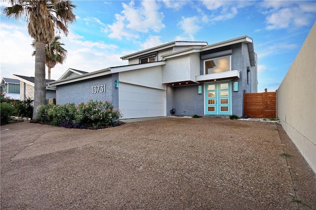 13731 Tajamar St, Corpus Christi, TX 78418 - view of front facade with brick siding, driveway, and a garage