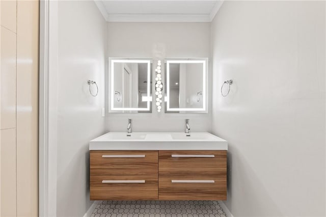 13731 Tajamar St, Corpus Christi, TX 78418 - bathroom with double vanity, ornamental molding, baseboards, and tile patterned floors