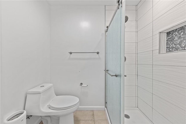 13731 Tajamar St, Corpus Christi, TX 78418 - bathroom with a stall shower, toilet, tile patterned floors, and baseboards