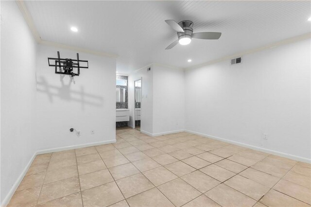 13731 Tajamar St, Corpus Christi, TX 78418 - empty room featuring ceiling fan, recessed lighting, ornamental molding, light tile patterned floors, and baseboards