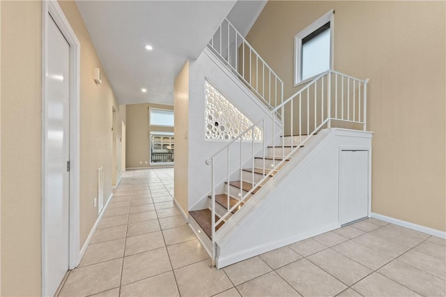 13731 Tajamar St, Corpus Christi, TX 78418 - staircase featuring tile patterned floors, healthy amount of natural light, baseboards, and recessed lighting