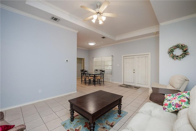 3829 Brockhampton Ct, Corpus Christi, TX 78414 - living room featuring a raised ceiling, light tile patterned flooring, crown molding, and a ceiling fan