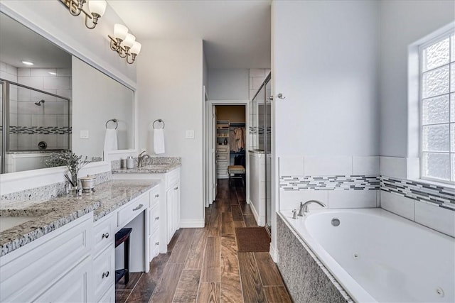 bathroom with plus walk in shower and vanity