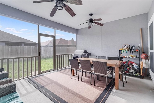 sunroom / solarium featuring ceiling fan