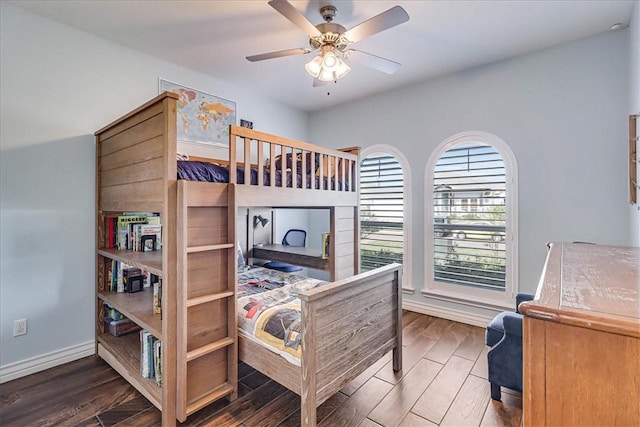 bedroom featuring ceiling fan and dark hardwood / wood-style floors