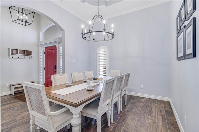 dining area featuring ornamental molding and a chandelier