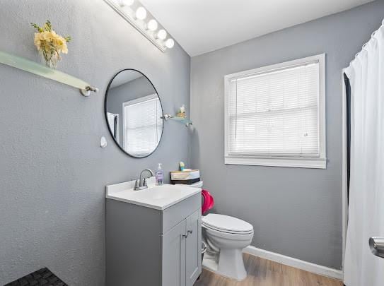 1058 Vaky St, Corpus Christi, TX 78404 - full bathroom with vanity and wood finished floors