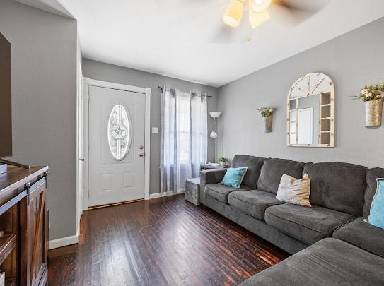 1058 Vaky St, Corpus Christi, TX 78404 - living room featuring ceiling fan and dark wood finished floors