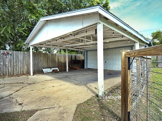 1058 Vaky St, Corpus Christi, TX 78404 - view of vehicle parking with a garage