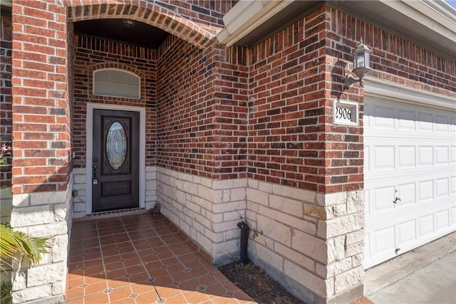 entrance to property featuring a garage