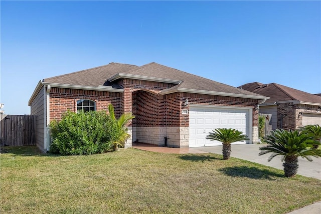 view of front of property with a garage and a front yard