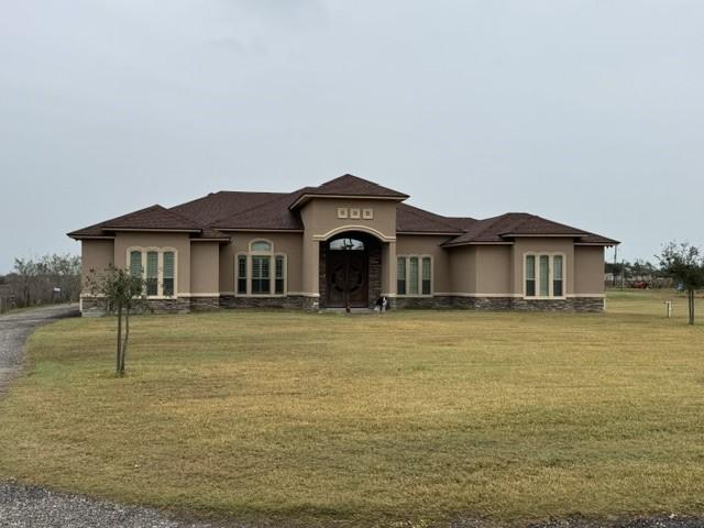 view of front of home with a front yard