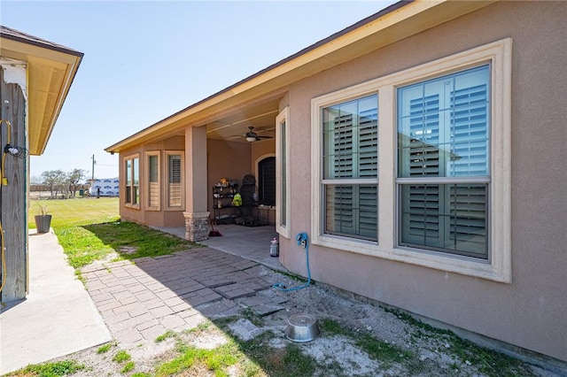 view of patio with ceiling fan