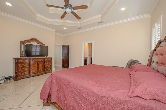 bedroom with light tile patterned floors, a tray ceiling, visible vents, and ornamental molding