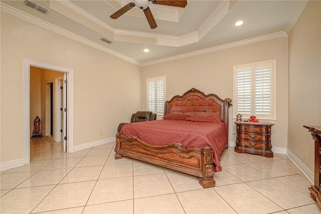 bedroom with a tray ceiling, visible vents, light tile patterned flooring, and ornamental molding