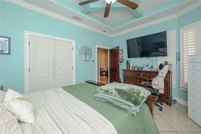 bedroom featuring light tile patterned floors, visible vents, a closet, and crown molding