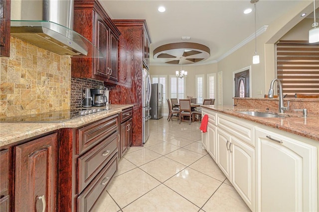 kitchen featuring black cooktop, light tile patterned flooring, a sink, ornamental molding, and wall chimney exhaust hood