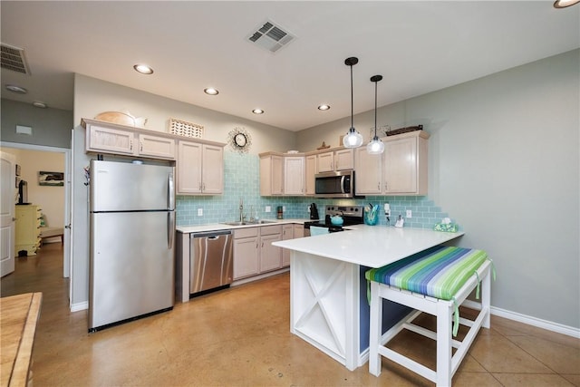 15209 S Padre Island Dr Unit 803, Corpus Christi, TX 78418 - kitchen with appliances with stainless steel finishes, a peninsula, light countertops, backsplash, and recessed lighting