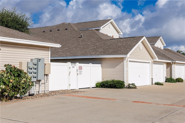 view of side of property with a garage