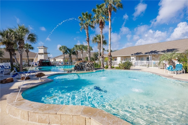 view of pool featuring pool water feature and a patio area