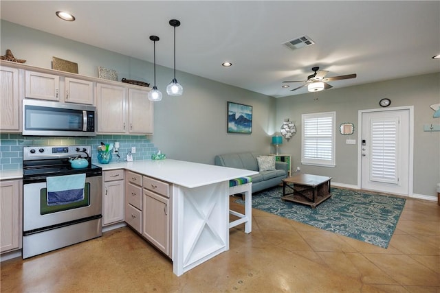 15209 S Padre Island Dr Unit 803, Corpus Christi, TX 78418 - kitchen featuring stainless steel appliances, a peninsula, open floor plan, light countertops, and recessed lighting