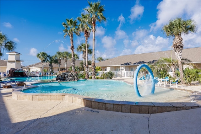 view of swimming pool featuring pool water feature