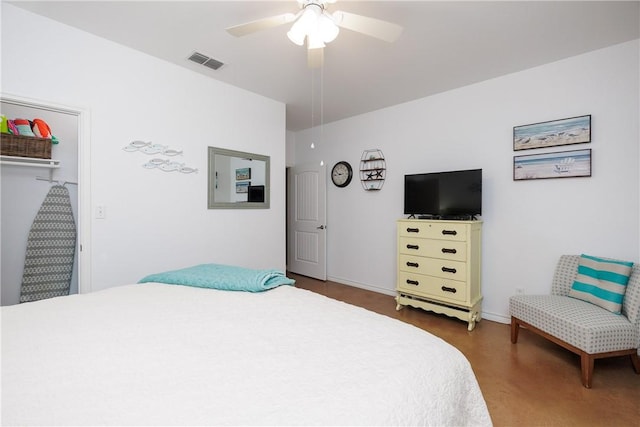 bedroom with ceiling fan, a closet, and dark wood-type flooring