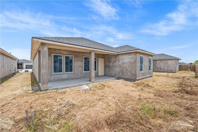 4018 Talbot Dr, Corpus Christi, TX 78414 - rear view of property featuring a patio, roof with shingles, and stucco siding