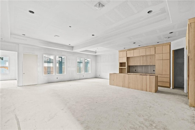 4018 Talbot Dr, Corpus Christi, TX 78414 - unfurnished living room with a raised ceiling and unfinished concrete flooring