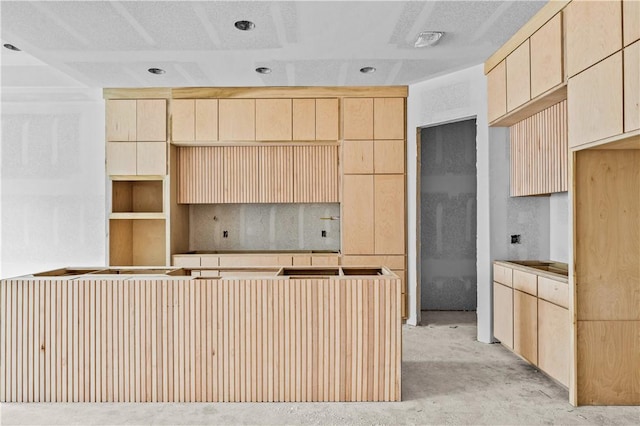 4018 Talbot Dr, Corpus Christi, TX 78414 - kitchen featuring light brown cabinets and unfinished concrete flooring
