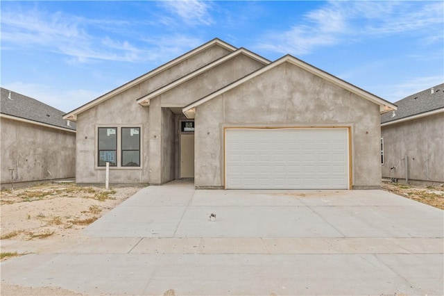 4018 Talbot Dr, Corpus Christi, TX 78414 - ranch-style house featuring a garage, driveway, and stucco siding