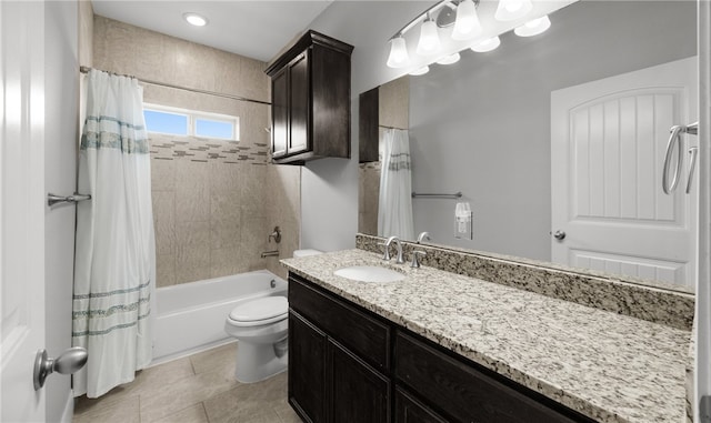 full bathroom with tile patterned flooring, vanity, toilet, and shower / bath combo with shower curtain