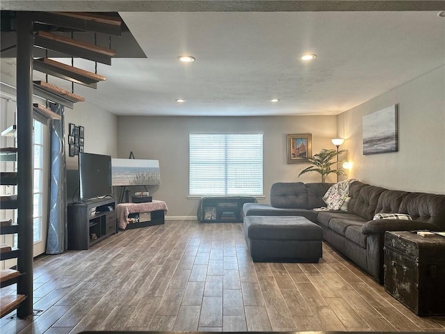 4117 Cork Dr, Corpus Christi, TX 78413 - living room with wood finished floors, recessed lighting, and stairway