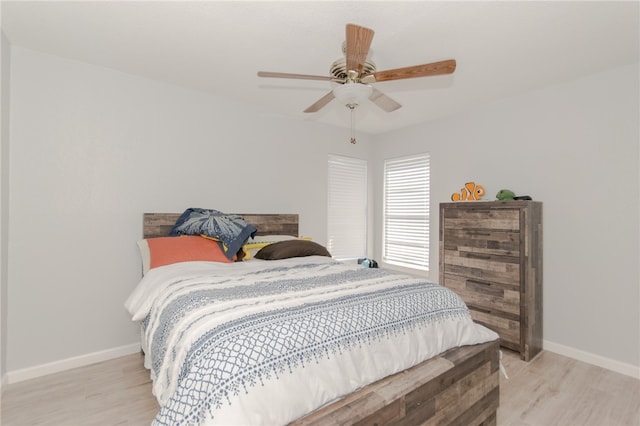 bedroom featuring light wood-type flooring and ceiling fan