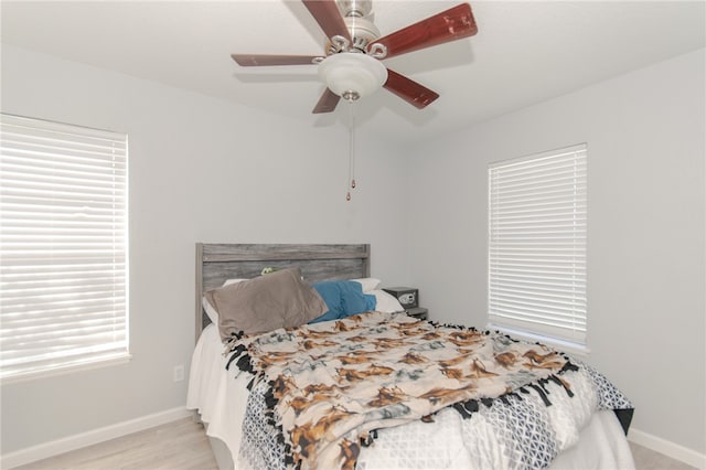 bedroom featuring light wood-type flooring and ceiling fan