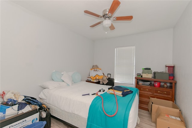 bedroom with ceiling fan and light wood-type flooring