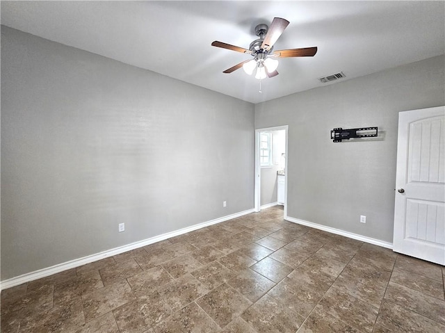 2021 Orange St, Corpus Christi, TX 78418 - unfurnished room featuring a ceiling fan and stone finish flooring
