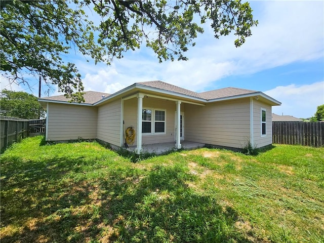 2021 Orange St, Corpus Christi, TX 78418 - rear view of house with a fenced backyard and a patio
