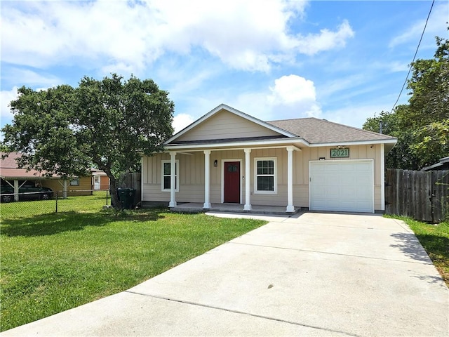 2021 Orange St, Corpus Christi, TX 78418 - view of front of home with covered porch, an attached garage, board and batten siding, driveway, and roof with shingles
